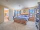 Spacious main bedroom with plush carpeting, large windows, and access to an ensuite bathroom at 8106 Eagle Clan Ct, Las Vegas, NV 89131