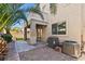 Backyard featuring patio with access to home, desert landscaping, and air conditioning units at 8220 Chimney Bluffs St, North Las Vegas, NV 89085