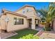 Backyard featuring a patio area, small grass patch, and privacy landscaping at 8220 Chimney Bluffs St, North Las Vegas, NV 89085