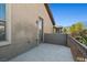Exterior balcony featuring iron railing and stucco wall detail for privacy and outdoor enjoyment at 8220 Chimney Bluffs St, North Las Vegas, NV 89085