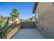 Outdoor balcony featuring iron railing with views of the neighborhood and clear skies at 8220 Chimney Bluffs St, North Las Vegas, NV 89085