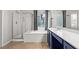 Modern bathroom featuring dual sinks, a separate shower, and a soaking tub at 8220 Chimney Bluffs St, North Las Vegas, NV 89085