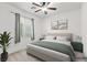 Bright bedroom with neutral tones, natural light, and comfortable queen bed at 8220 Chimney Bluffs St, North Las Vegas, NV 89085
