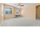 Bright bedroom with dual windows and carpeted floors, offering a cozy and inviting space at 8220 Chimney Bluffs St, North Las Vegas, NV 89085