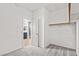 Walk-in closet featuring carpet and an adjacent bathroom at 8220 Chimney Bluffs St, North Las Vegas, NV 89085