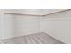 Walk-in closet with carpet flooring and wooden clothing racks at 8220 Chimney Bluffs St, North Las Vegas, NV 89085