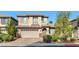 Charming two-story home featuring a two-car garage and manicured landscaping at 8220 Chimney Bluffs St, North Las Vegas, NV 89085