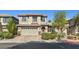 Charming two-story home featuring a two-car garage and manicured landscaping at 8220 Chimney Bluffs St, North Las Vegas, NV 89085