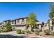 Two-story home featuring a two-car garage and manicured landscaping at 8220 Chimney Bluffs St, North Las Vegas, NV 89085