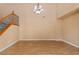 Foyer showcasing laminate floors, neutral paint and a large chandelier at 8220 Chimney Bluffs St, North Las Vegas, NV 89085