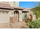 Inviting home entrance with stone accents and tidy front yard landscaping at 8220 Chimney Bluffs St, North Las Vegas, NV 89085