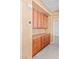 Hallway featuring ample storage space with built-in cabinets and neutral color palette at 8220 Chimney Bluffs St, North Las Vegas, NV 89085