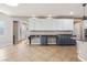 Open kitchen featuring light countertops, dark cabinets, and tile flooring at 8220 Chimney Bluffs St, North Las Vegas, NV 89085