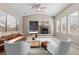 Inviting living room featuring a fireplace, recessed lighting, and ample natural light at 8220 Chimney Bluffs St, North Las Vegas, NV 89085