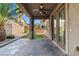 Back patio featuring a ceiling fan and brick flooring, providing a comfortable outdoor living space at 8220 Chimney Bluffs St, North Las Vegas, NV 89085