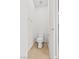 A clean and simple toilet room with tile flooring and a toilet at 8220 Chimney Bluffs St, North Las Vegas, NV 89085