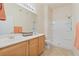 Bright bathroom featuring double sinks, large mirror, and walk-in shower at 8985 S Durango Dr # 1177, Las Vegas, NV 89113