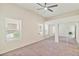 Spacious bedroom featuring mirrored closet doors and a large window at 8985 S Durango Dr # 1177, Las Vegas, NV 89113