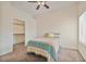 Bedroom with a ceiling fan, window and walk-in closet at 8985 S Durango Dr # 1177, Las Vegas, NV 89113