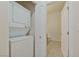 Efficient laundry room with stacked washer and dryer and extra storage at 8985 S Durango Dr # 1177, Las Vegas, NV 89113