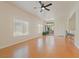 Bright living room features hardwood floors, ceiling fan, and sliding glass doors to a private patio at 8985 S Durango Dr # 1177, Las Vegas, NV 89113