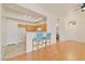 Living space and kitchen featuring hardwood floors and barstool seating at 8985 S Durango Dr # 1177, Las Vegas, NV 89113
