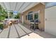 Covered back patio area with grill and outdoor seating, perfect for entertaining at 9220 Evergreen Canyon Dr, Las Vegas, NV 89134