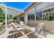 Relaxing back patio featuring a pergola, lounge chairs, and ample sunlight at 9220 Evergreen Canyon Dr, Las Vegas, NV 89134
