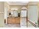 Bright bathroom showcasing double sinks, granite countertops, soaking tub, and a view into the walk-in closet at 9220 Evergreen Canyon Dr, Las Vegas, NV 89134