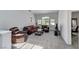 Cozy living room featuring plush carpeting, comfortable seating, and large windows for natural light at 9220 Evergreen Canyon Dr, Las Vegas, NV 89134