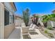 Cozy patio featuring comfortable seating and beautiful landscaping at 9220 Evergreen Canyon Dr, Las Vegas, NV 89134