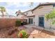 Private backyard showcasing desert landscaping, brick pavers, patio space, and stucco exterior at 944 Angel Star Ln, Las Vegas, NV 89145
