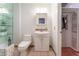 Bathroom with white vanity and closet with clothing storage at 944 Angel Star Ln, Las Vegas, NV 89145