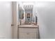 Cozy bathroom featuring a granite countertop and vanity with modern fixtures at 944 Angel Star Ln, Las Vegas, NV 89145