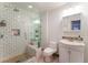 Bathroom with a glass door shower and white tiled walls at 944 Angel Star Ln, Las Vegas, NV 89145