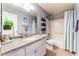 Bright bathroom featuring a granite countertop, stylish accessories, and a shower over tub at 944 Angel Star Ln, Las Vegas, NV 89145