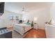 Bright bedroom with a ceiling fan, wood floors, and natural light at 944 Angel Star Ln, Las Vegas, NV 89145