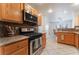 Functional kitchen with stainless steel appliances and a pass-through to the dining area at 944 Angel Star Ln, Las Vegas, NV 89145