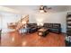 Warm living room with hardwood floors leading into the dining area, perfect for entertaining at 944 Angel Star Ln, Las Vegas, NV 89145
