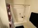 Bathroom with a tub, shower, and patterned shower curtain at 9580 W Reno Ave # 283, Las Vegas, NV 89148