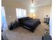 Inviting bedroom with a large window, neutral walls, and exercise equipment at 9580 W Reno Ave # 283, Las Vegas, NV 89148