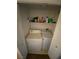 Convenient laundry area features a washer, dryer, and overhead shelving at 9580 W Reno Ave # 283, Las Vegas, NV 89148