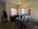 Bright home office with a desk, chair, and access to an outdoor balcony at 9580 W Reno Ave # 283, Las Vegas, NV 89148