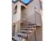 Exterior staircase with secure railings leading to upper-level residences at 9580 W Reno Ave # 283, Las Vegas, NV 89148