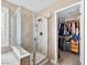 Modern bathroom showcases a stylish glass-enclosed shower and walk-in closet at 10612 Gum Tree Ct, Las Vegas, NV 89144