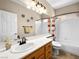 Bright bathroom featuring vanity, toilet and shower over tub at 10612 Gum Tree Ct, Las Vegas, NV 89144