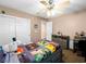 This bedroom features a bed with a Minecraft quilt, a ceiling fan and storage at 10612 Gum Tree Ct, Las Vegas, NV 89144