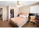 This bedroom features a cozy bed, ceiling fan and includes a closet and desk area at 10612 Gum Tree Ct, Las Vegas, NV 89144