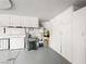 Spacious garage featuring lots of cabinets for storage and organization at 10612 Gum Tree Ct, Las Vegas, NV 89144