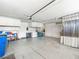 Organized garage with storage cabinets, overhead door, and a clean, spacious floor at 10612 Gum Tree Ct, Las Vegas, NV 89144